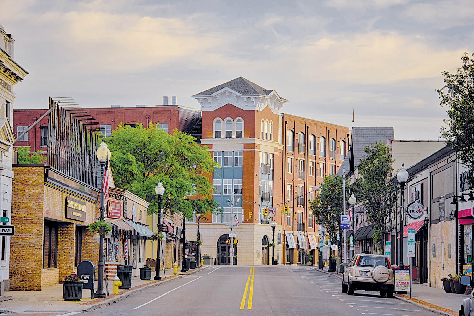 Downtown Patchogue, Long Island, New York with Main Street shops, restaurants, and historic buildings along a village street.