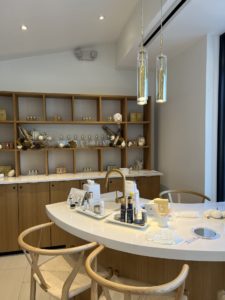 AIREM Modern skincare studio with beauty products, sleek decor, and pendant lighting