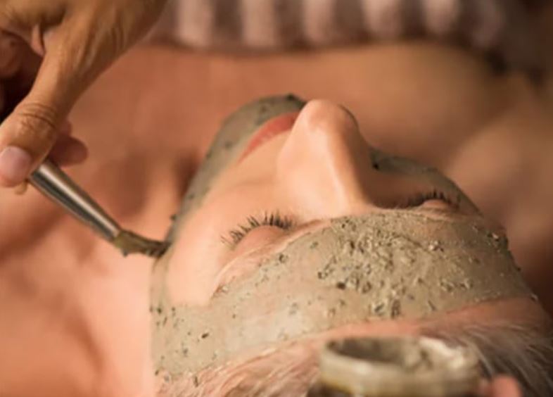 Woman getting a facial at Canoe Place Spa