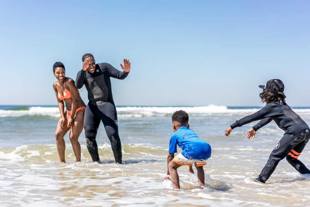 Family playing in the waves at a South Shore Long Island beach