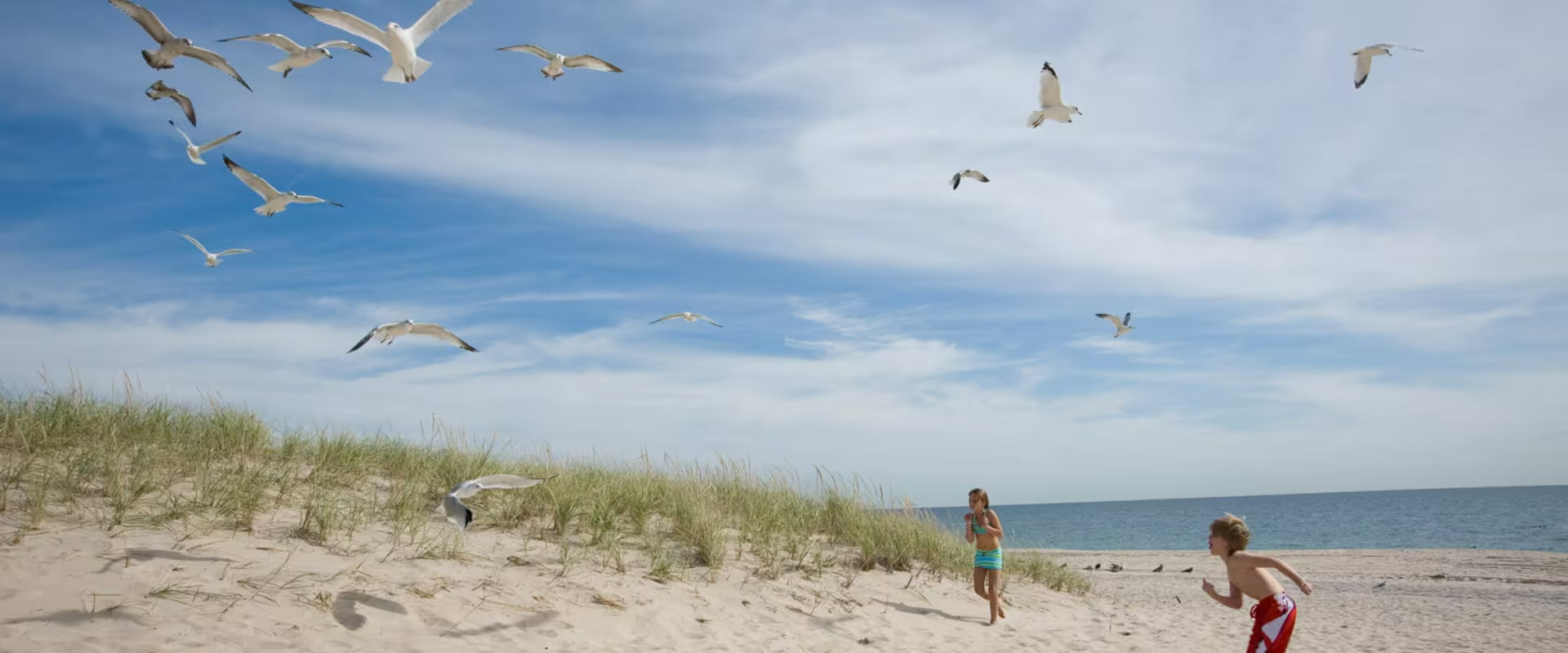 Children running and playing at Coopers Beach on Long Island
