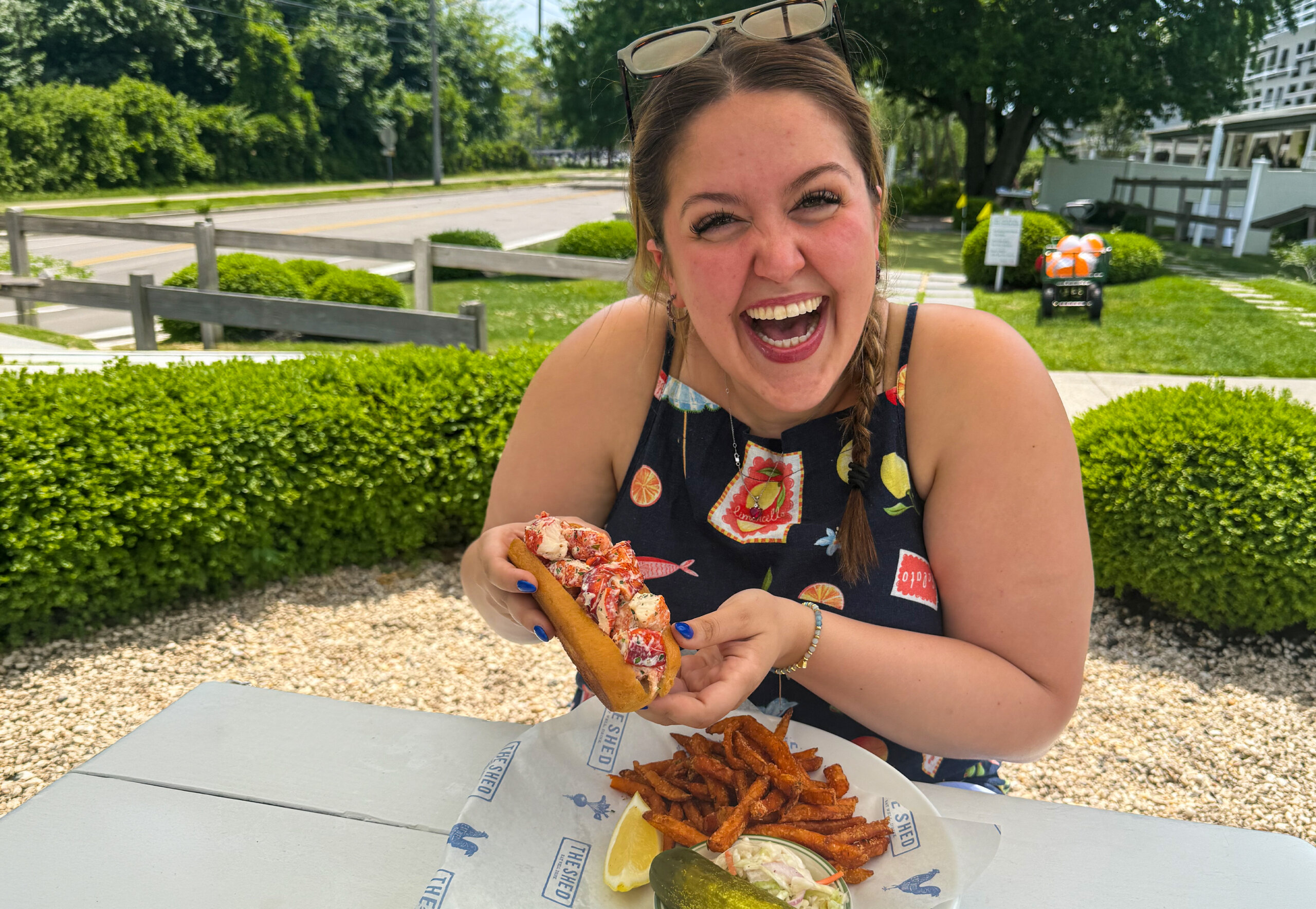 woman enjoying a hot dog on Long Island