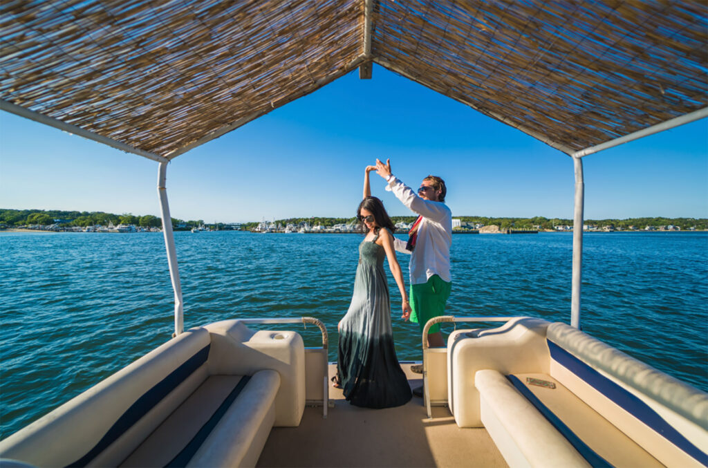 Couple enjoying a boat ride in the Hamptons, Long Island