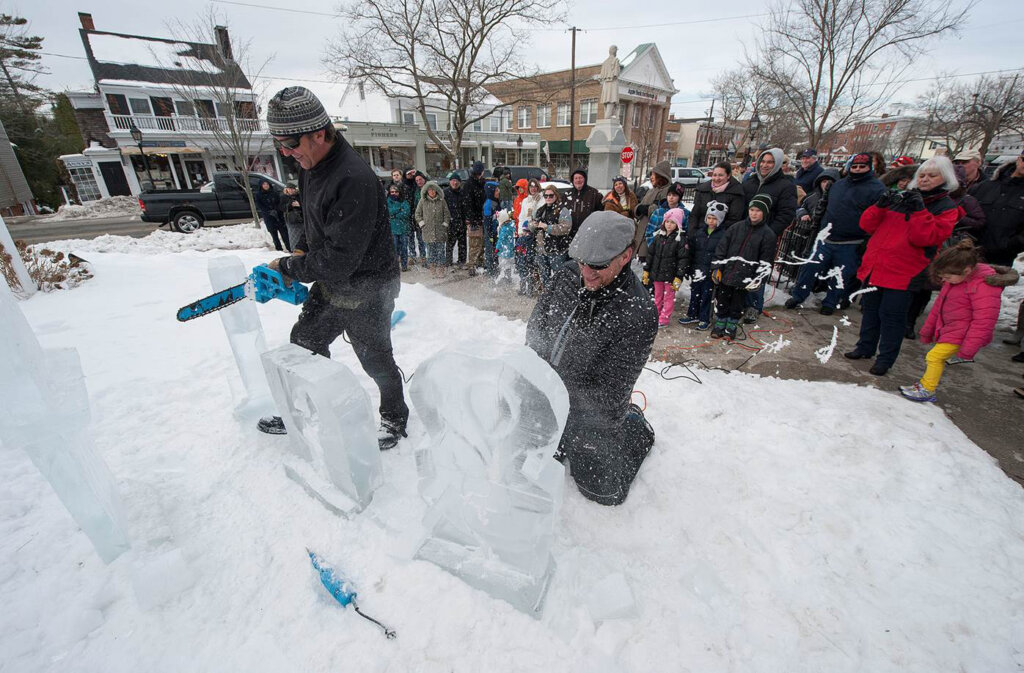 Visitors enjoying a winter harbor festival on Long Island