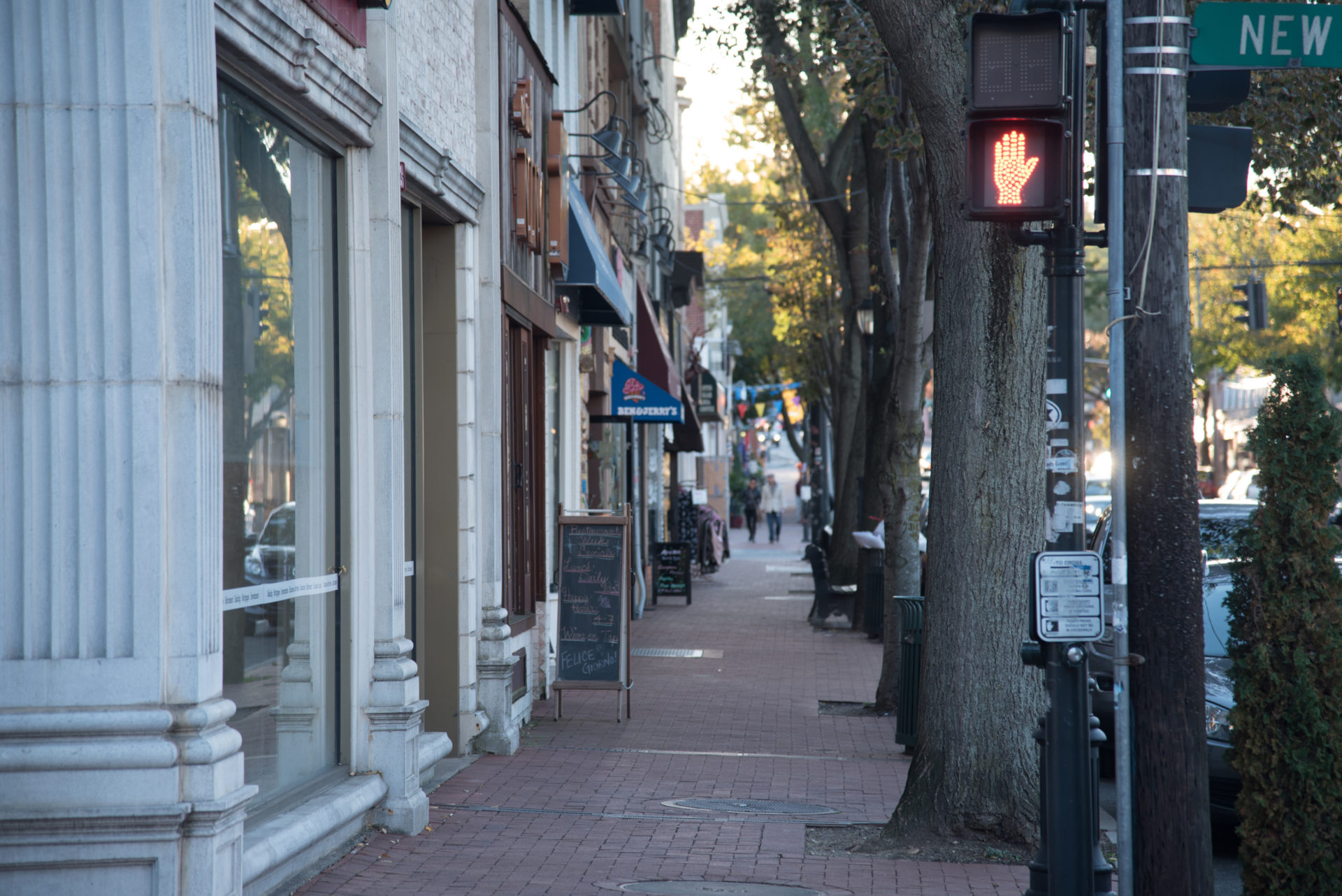 Pedestrians walking along a Downtown Huntington shopping street, Long Island