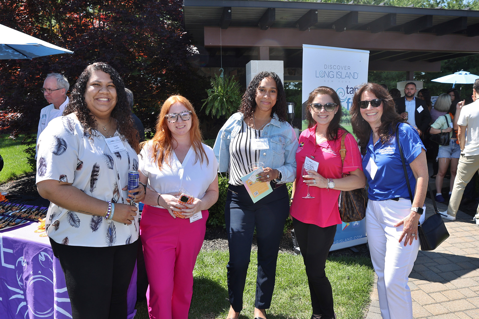 Business partners networking at a Long Island event
