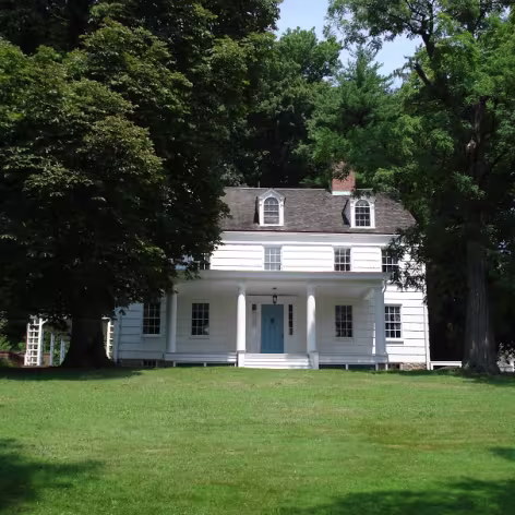 Joseph Lloyd Manor white house surrounded by trees