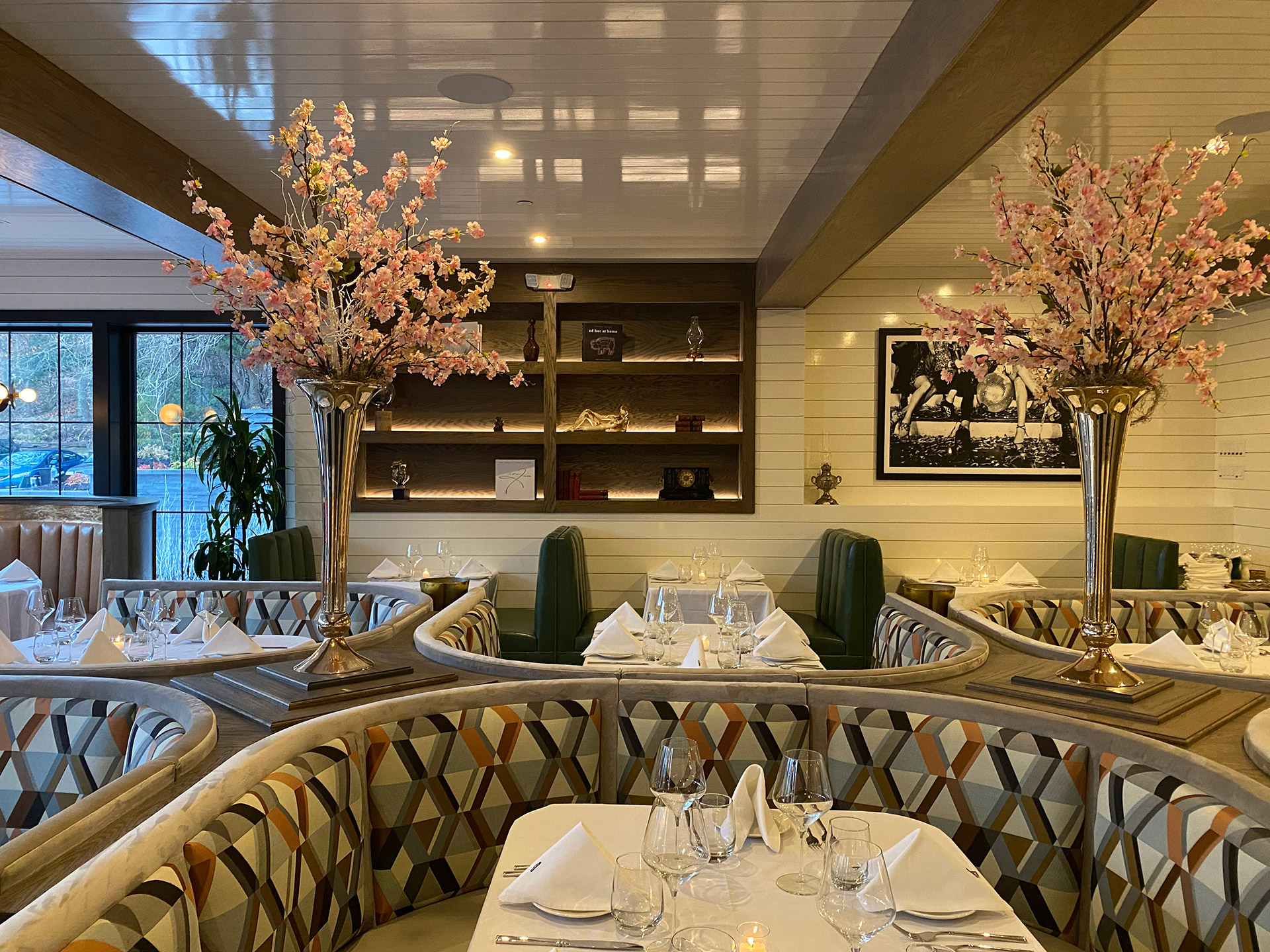 Elegant dining room with floral centerpieces at Arlo restaurant on Long Island