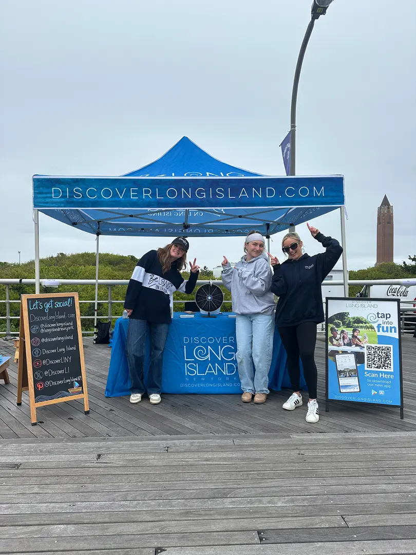 Staff at a Discover Long Island promotional booth near Jones Beach
