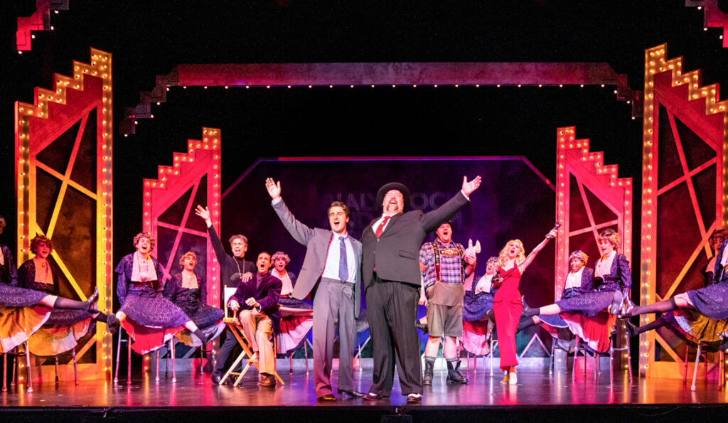 Cast performing 'The Producers' musical on a Long Island stage