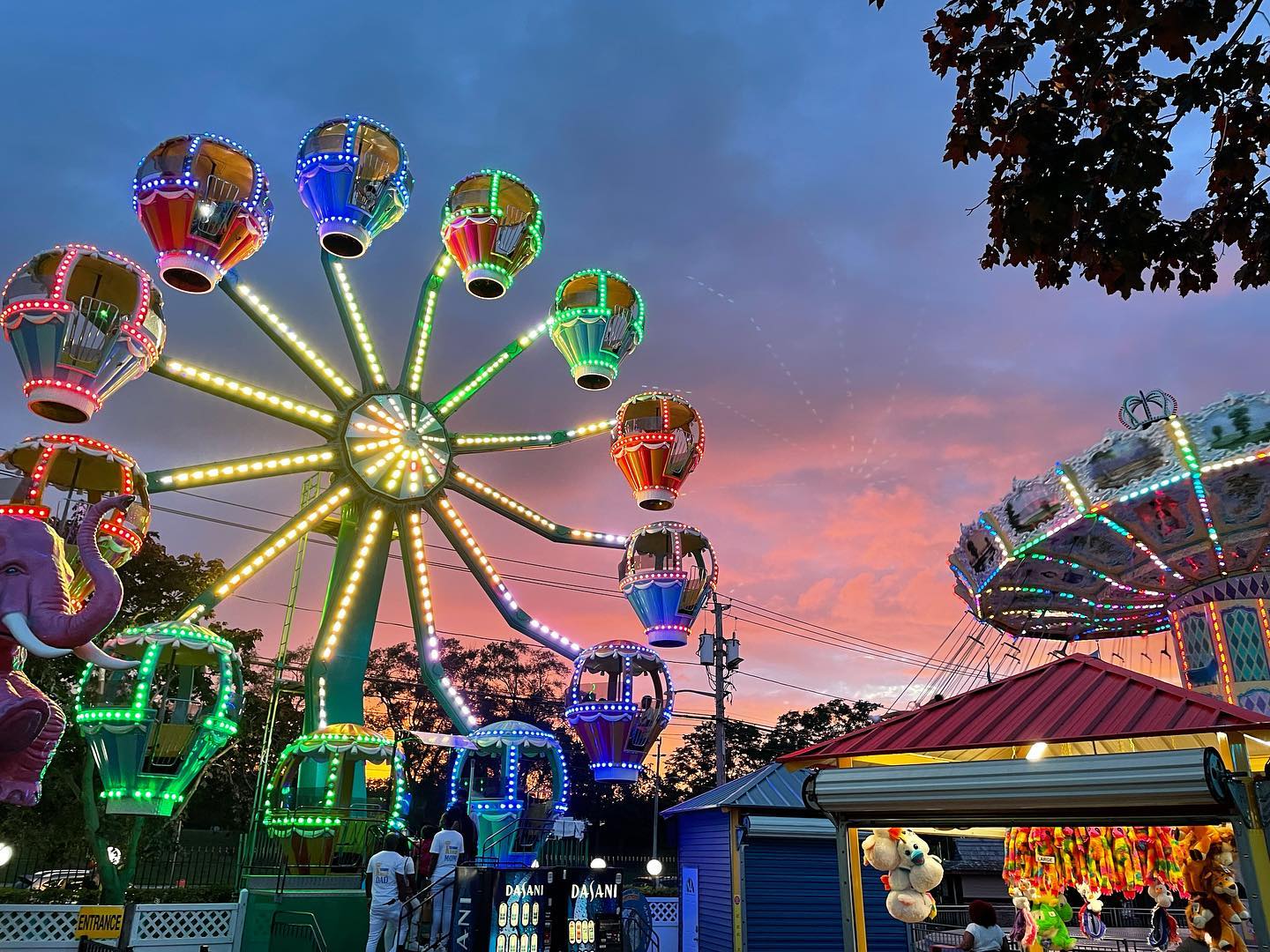 Ferris wheel lit up at dusk at Adventureland amusement park, Long Island