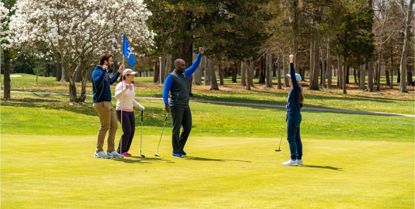 Golfers celebrating on a Long Island golf course in spring