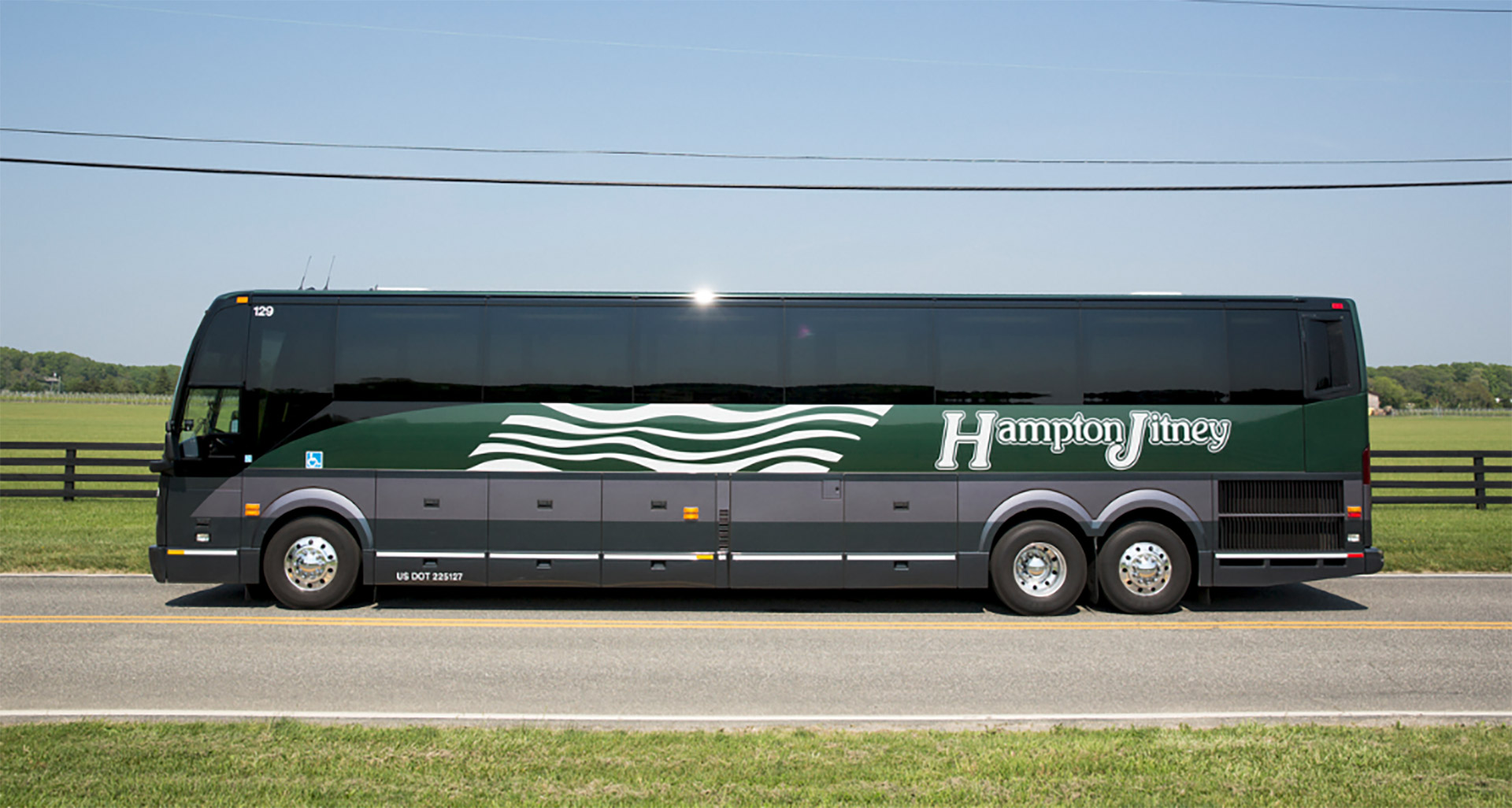 Hampton Jitney motorcoach traveling on a Long Island road