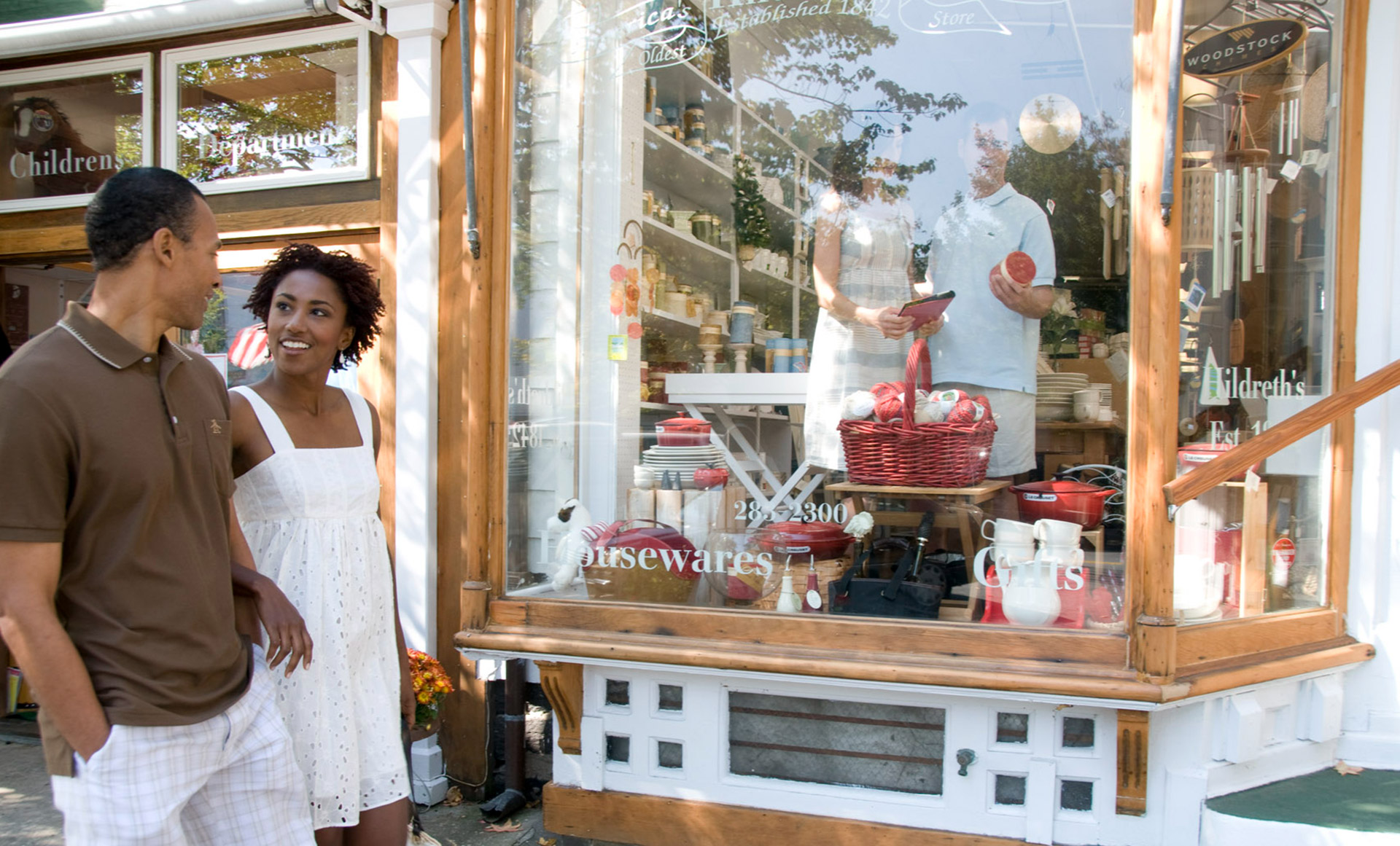 Couple browsing a boutique storefront in the Hamptons, Long Island