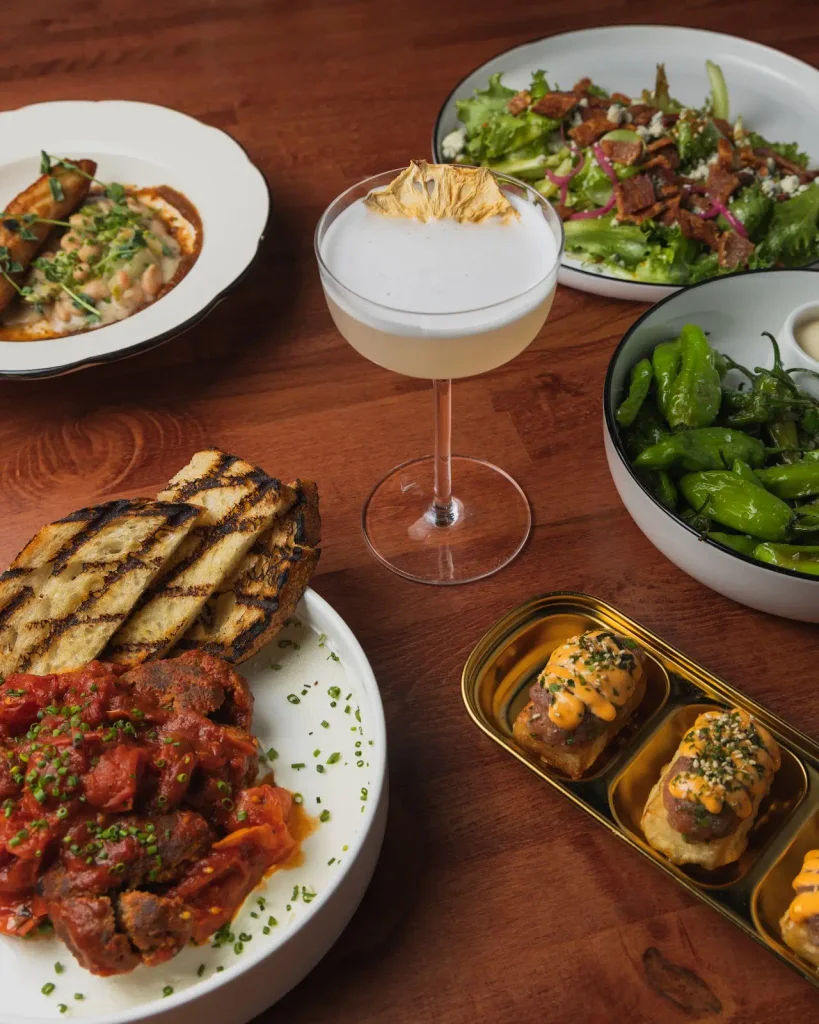 Various dishes and cocktail from Lola's Kitchen and Cocktails.